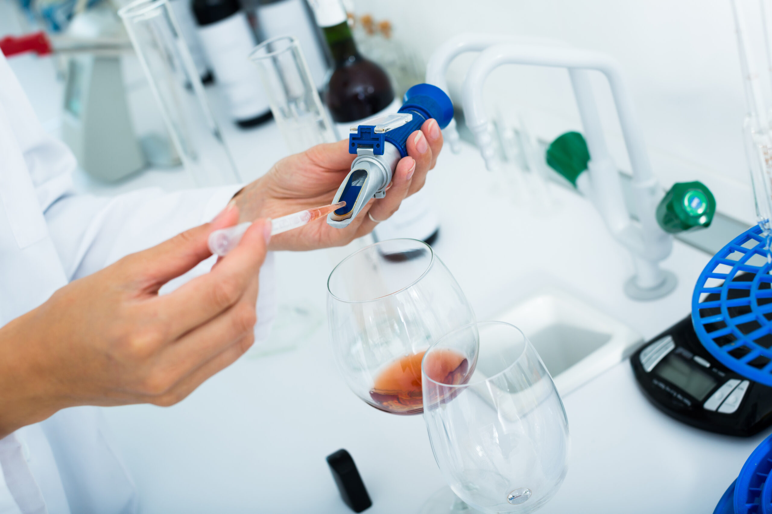 Close up on hands testing quality in chemical laboratory